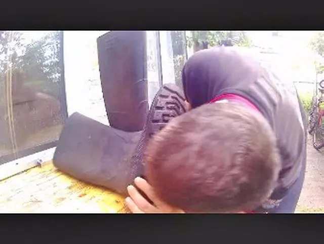 dreckige Gummistiefel